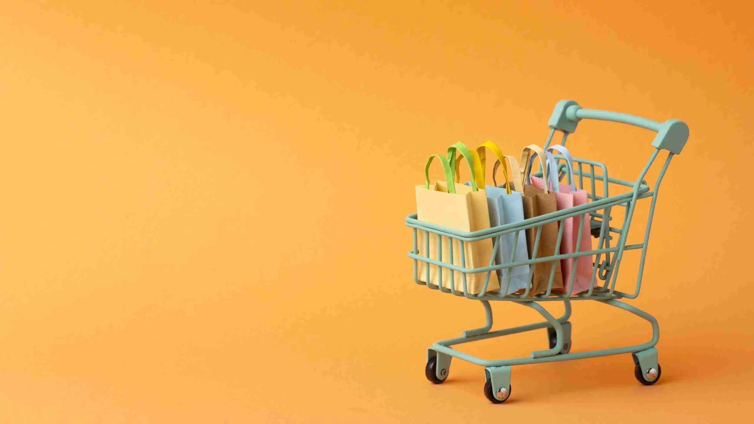 Panier d'achat coloré sur fond orange, création boutique en ligne efficace avec NUAWEB Québec
